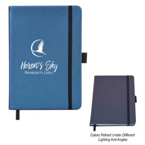 personalized blue color changing journal with strap closure, elastic pen loop, and an imprint saying heron's sky research labs