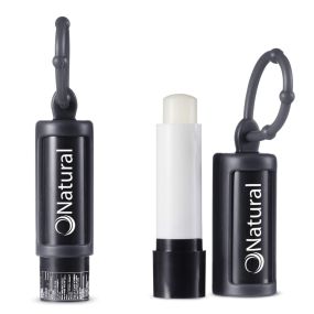 black lip balm with a matching silicone holder and an imprint saying Natural