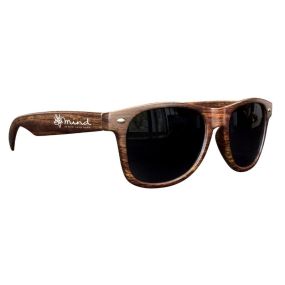 medium wood tone sunglasses with an imprint on the side saying mind