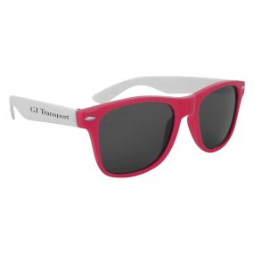 pink sunglasses with white temples and an imprint saying GI Transport