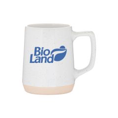 white mug with speckled finish and natural base with an imprint saying bio land