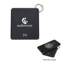 black wireless charger and powerbank with an imprint saying audiomusic