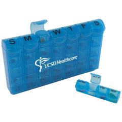 blue compartment pill box with labels specifying throughout the week and an imprint in the middle saying ucsd healthcare