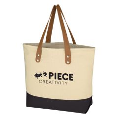 natural cotton tote bag with leatherette handles, black bottom, and an imprint saying piece creativity