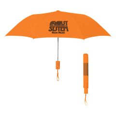 orange umbrella with an imprint saying Against System Rock Music with a wrist strap and a matching sleeve
