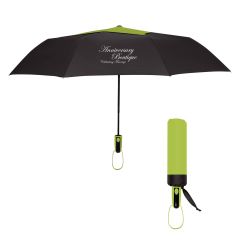 black umbrella with a green top and an imprint saying Anniversary Boutique Celebrating Marriage