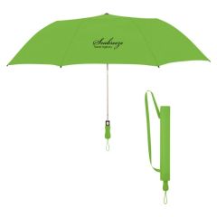 green umbrella with a matching sleeve and an imprint saying Seabreeze Travel Agency