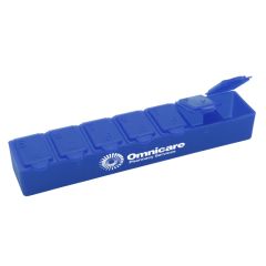 blue 7 day pill case with letters indicating the week and braille below it and an imprint on the front that says omnicare pharmacy services
