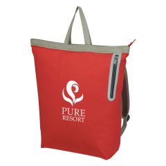 A red backpack tote bag with a zippered compartment, side zippered compartment, adjustable straps, and an imprint saying Pure Resort