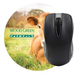 custom circle mouse pad with an imprint of a cow and text to the left of it saying wood green animal shelters leading animals home