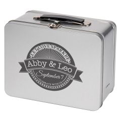 silver tin lunch box with plastic handle and an imprint saying abby & leo let let sparkle with September 7 and celebrate with us text at the bottom