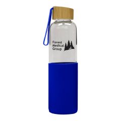 glass bottle with blue silicone sleeve, bamboo lid, and an imprint saying forest medical group