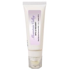 white sunscreen bottle with lip balm and an imprint of a purple gradient background and text saying mountain valley spa & resort