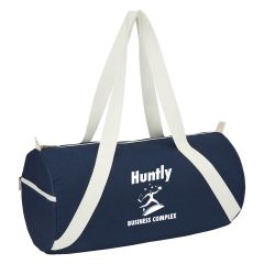 navy duffel bag with white straps with a zippered compartment and an imprint saying Huntly Business Complex