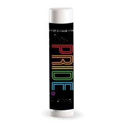 white lip balm with an imprint of a black background and text saying pride in rainbow colors