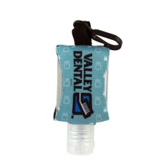 a hand sanitizer bottle with a customized neoprene sleeve saying Valley Dental and black clip