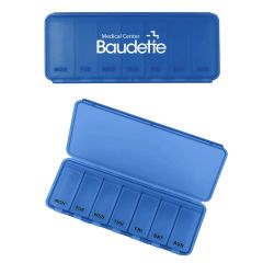 blue weekly pill case with an imprint saying Medical Center Baudette