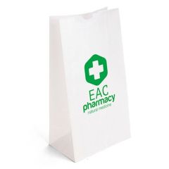 white kraft paper bag with an imprint saying EAC Pharmacy Natural Medicine