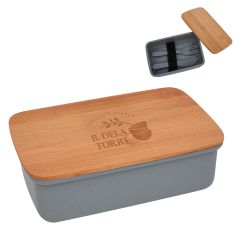 a gray lunch container with utensils inside and a bamboo lid with a laser engraving saying Cooking Supply B. Dela Torre