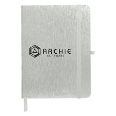 metallic notebook with a elastic band, pen loop, and bookmark with an imprint saying Archie Software