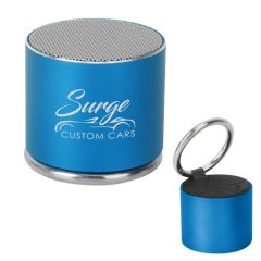 blue wireless speaker with a round carabiner and an imprint saying Surge Custom Cars