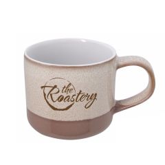 brown neutral-colored mug with an imprint saying The roastery