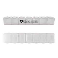 clear 7 day pill case with an imprint saying corinth & joseph with a slogan saying the healthcare that you deserve 