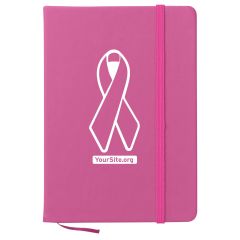 pink journal with matching strap closure and breast cancer ribbon imprint on journal with yoursite.org text below