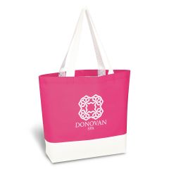 a pink and white tote bag with an imprint saying donovan spa