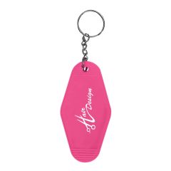 pink motel keychain tag with an imprint saying hair design