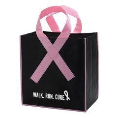 a black tote bag with a pink ribbon handle and an imprint on the bottom saying Walk. Run. Cure