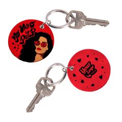 yellow motel keychain with an imprint saying hair designs