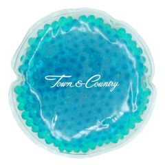 round teal gel bead hot and cold pack with an imprint saying town & country