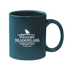 green mug with an imprint saying Western Meadowlark National Park Wyoming State