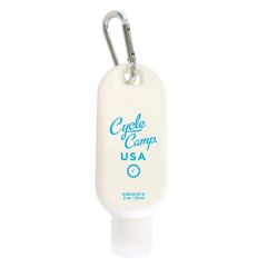 white sunscreen bottle with a carabiner with an imprint saying cycle camp usa