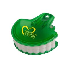 translucent green teeth food clip with an imprint saying kensington dental spa