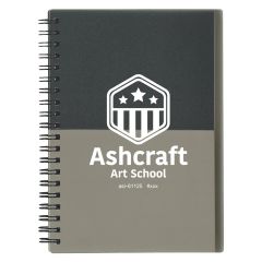two tone gray and black notebook with an imprint saying ashcraft art school