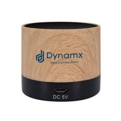 woodgrain wireless speaker with an imprint saying Dynamx Digital Innovation Service